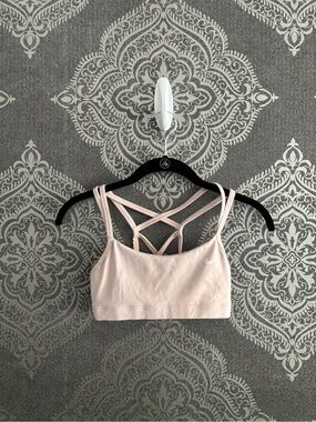 Nike pale pink strappy sports bra with crisscross back